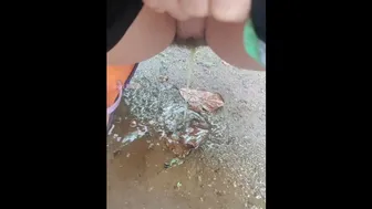 Girl Peed Desperately In The Rain To The Puddle