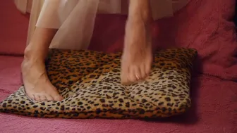 The Ballerina's Legs Stretch & Dance On A Spotted Pillow